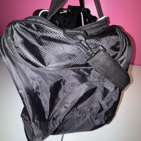 Black Duffel Bag with White Accents and Modern Design - Picture 4 of 13